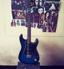 Electric guitar color blue and amplifier set photo